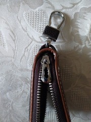 Leather zip up pouch with keyring.