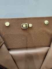 LOUIS VUITTON PARIS, MADE IN FRANCE” brown nylon garment sleeve & « LV » hanger