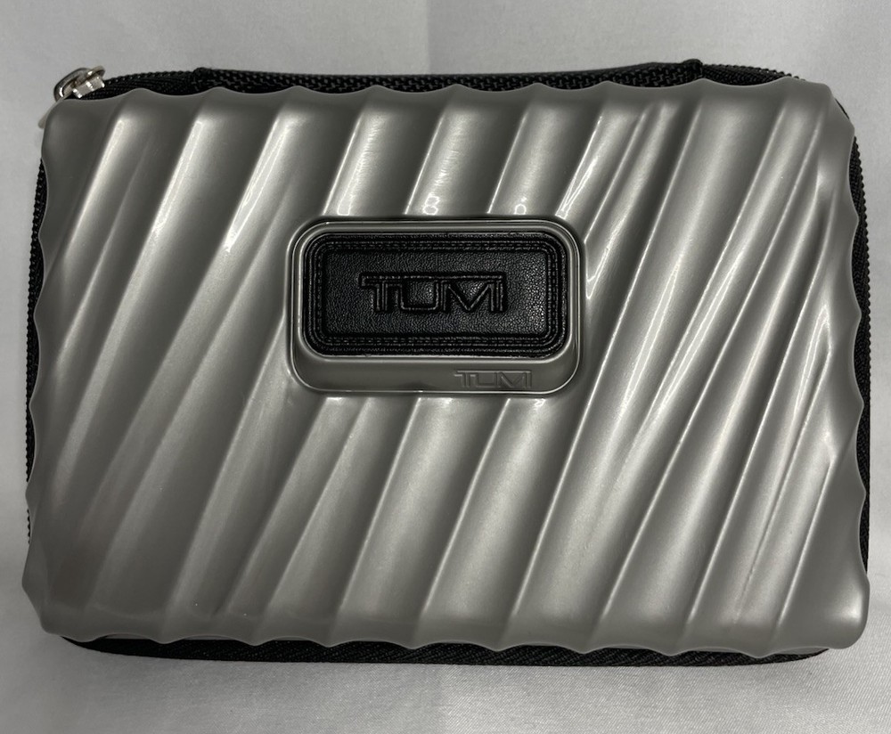 Tumi For Delta Silver Gray Hard Shell Cosmetic Zipper Case With Misc Items