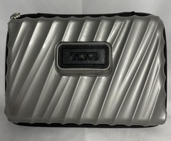 Tumi For Delta Silver Gray Hard Shell Cosmetic Zipper Case With Misc Items
