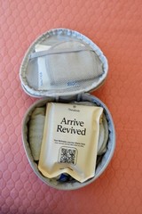 Therabody Travel Comfort Kit w/ Socks Dental Kit Sleep Mask Hand Cream Eye Serum